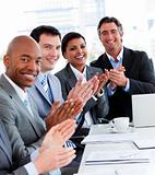 Team of successful multi-ethnic business people applauding