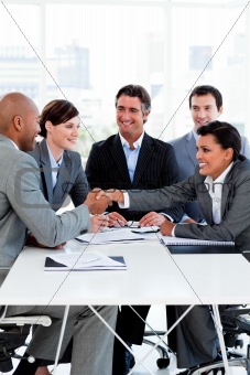 Successful international business people shaking hands