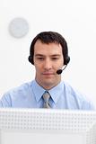 Serious businessman with headset on