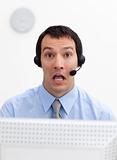 Laughing businessman with headset on 