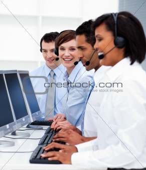 Young business people with headsets on working in call center