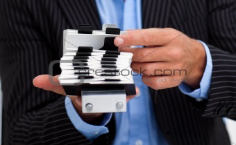 Close-up of a businessman holding a card holder