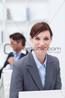 Young businesswoman working at a computer