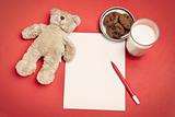 Blank letter with bear, cookies and milk