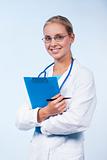 Portrait of a female doctor smiling holding a clipboard
