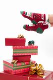 Female legs in christmas stockings isolated on white. Gifts on t