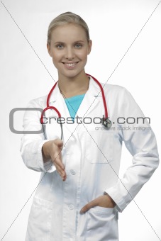 Happy female doctor giving hand for handshake, isolated on white