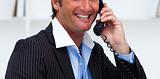 Close-up of a smiling businessman talking on phone 