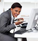 Business woman working at computer in the office.