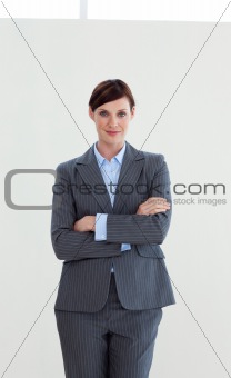 Attractive businesswoman with folded arms 