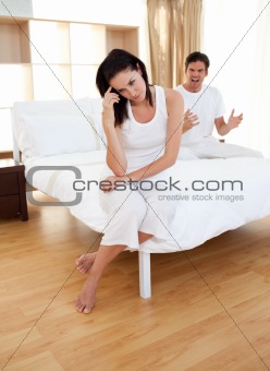 Couple having an argument in bedroom