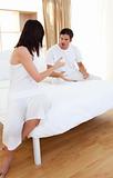 Couple on bed having a row