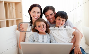 Happy family surfing the internet