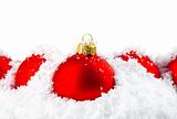 Christmas holiday decoration with white snow and red bowls