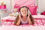 Cute girl listening music with headphones