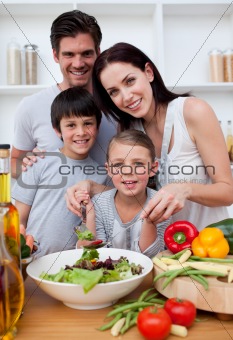 Smiling family cooking together