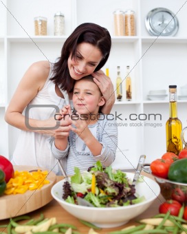 Happy mother and daughter in kitchen