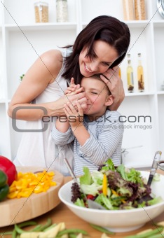 Mother and her little girl having fun in the kitchen