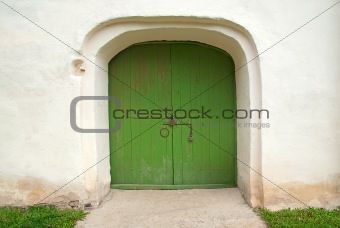 medieval wooden door painted in green