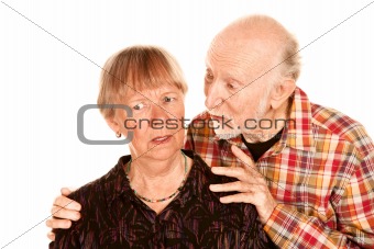 Senior man sharing information with concerned wife