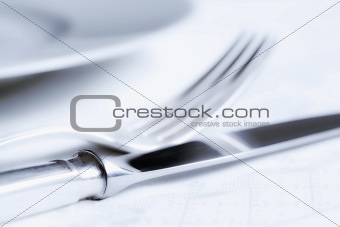 elegant table setting with silverware and white plate