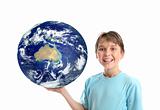 Smiling child holding our world planet showing Australia Oceania