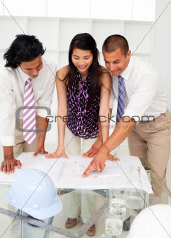 International engineers discussing a construction plan