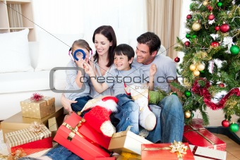 Happy family having fun with Christmas presents