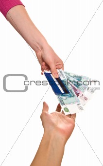 Credit card and denominations in a female hand