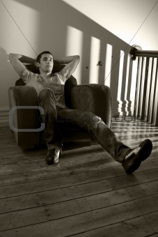 Young man relaxing on a chair