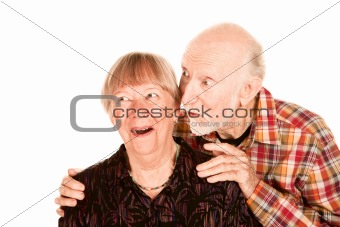 Happy senior couple looking left