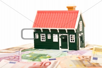 House on money field or foundation - isolated