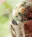 Wedding bouquet in female handbag