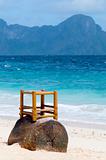 wooden chair on a beach