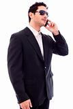 Handsome young business man talking on phone