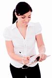 Young business woman writing in a clip Board