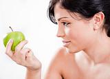 Beautiful woman holding a green apple
