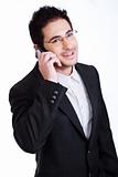 Handsome young business man talking over phone