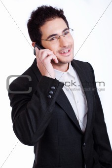 Handsome young business man talking over phone