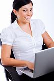 Young attractive business woman smiling while surfing the net