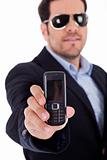 Business man wearing sunglasses and showing a Nokia mobile