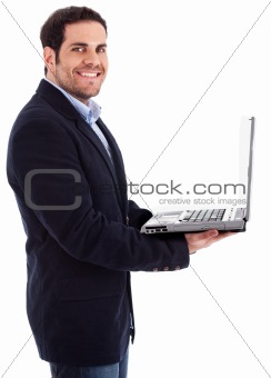Young professional man smiling with a laptop in his hand