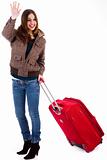 Attractive young women travelling with suitcase