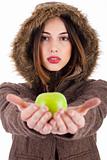 Beautiful young lady showing green apple 