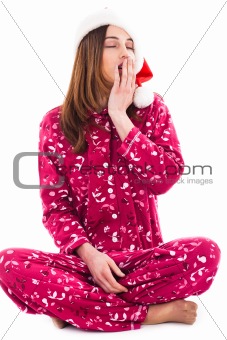 Santa girl sitting and yawning