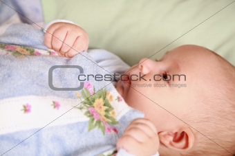Adorable newborn in bed