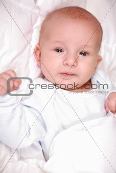 Adorable newborn in bed