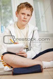 Teenage boy doing his homework