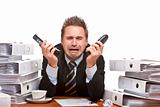 Stressed business man  with two telephones is cryoing in office 