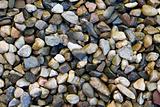 abstract background - a layer of wet small stones of different colors